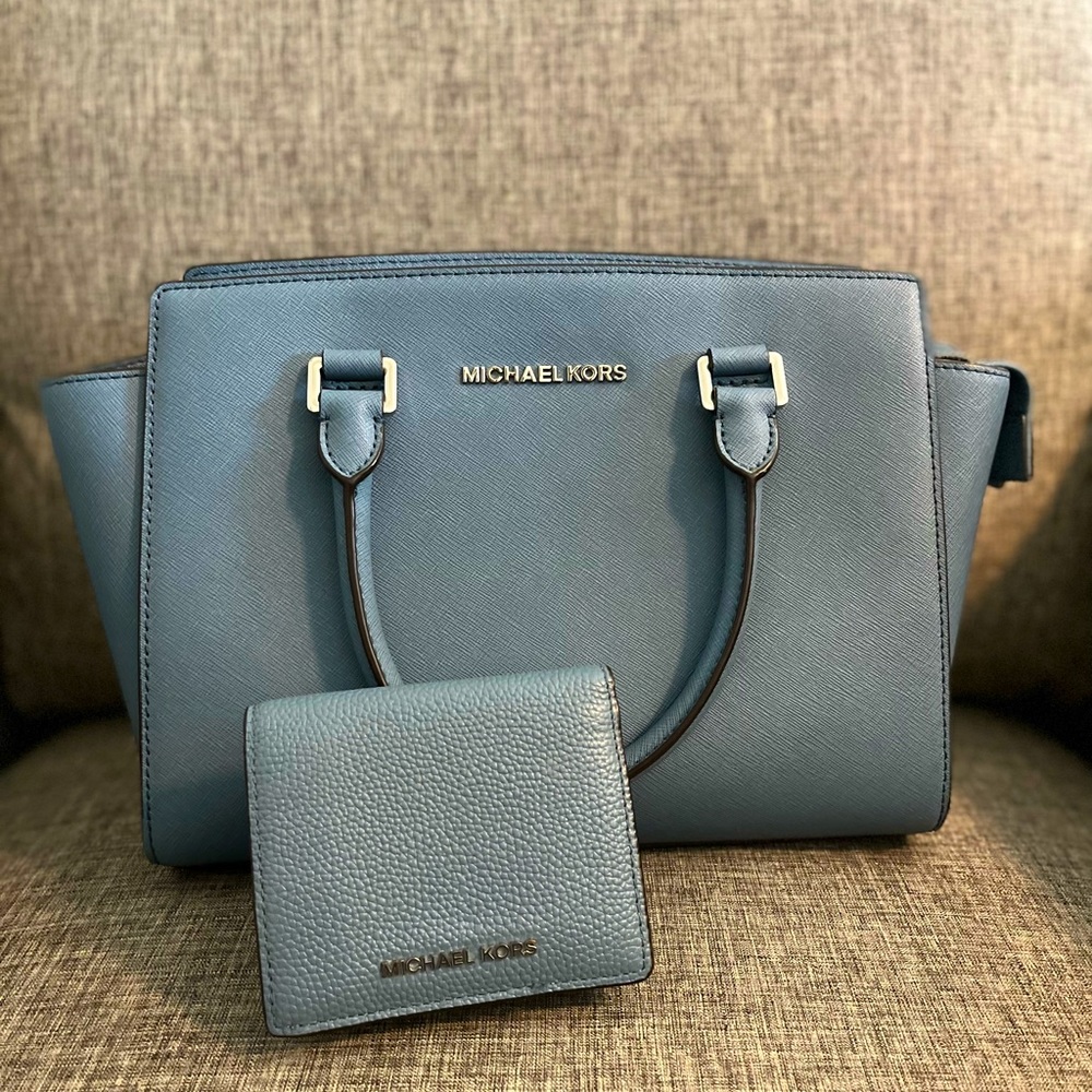 Authentic Michael Kors Satchel with matching wallet.